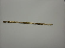 Load image into Gallery viewer, A gold-toned metal chain bracelet with a lobster clasp, laid horizontally on a plain light gray background.